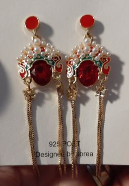 Super cute and different!  I love the bright red and the dangly gold f0